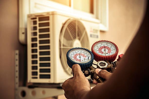 Professional Heat Pump Repair technician working in Grain Valley, MO